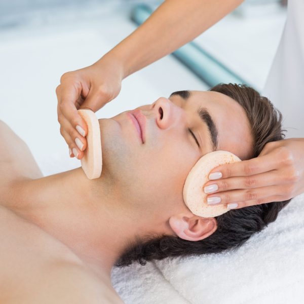 Close,-up,Of,A,Handsome,Young,Man,Receiving,Facial,Massage